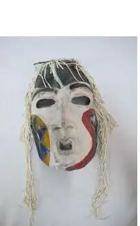 The Stick Spirits mask by Lillian Pitt, with braided cord fringe
