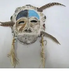 A second Stick Spirits mask by Lillian Pitt, adorned with feathers