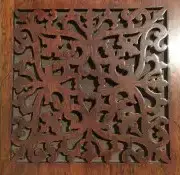 Detail of a carved rosewood panel on the piano