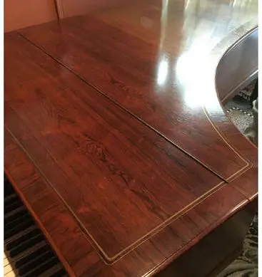 Detail of the piano's inlaid rosewood cabinet