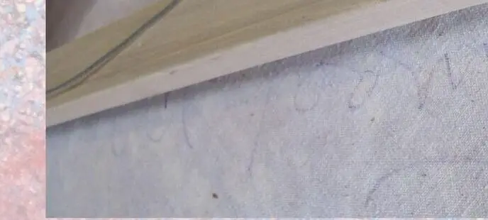 The back of the canvas, showing Alvin D. Loving's pencil signature and inscription