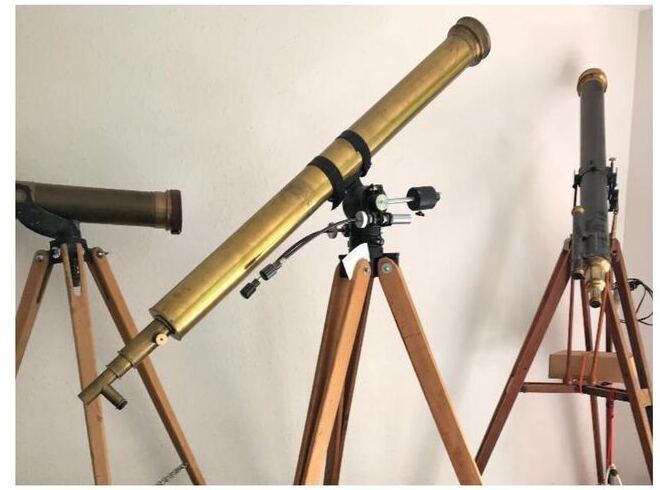 Antique brass refracting telescopes on wooden tripods from the Peter Abrahams estate